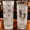 Lone Star Seal Texas Engraved Tequila Shot Glasses – Bar Display Texas Lone Star Seal engraved tequila shot glasses displayed on bar counter